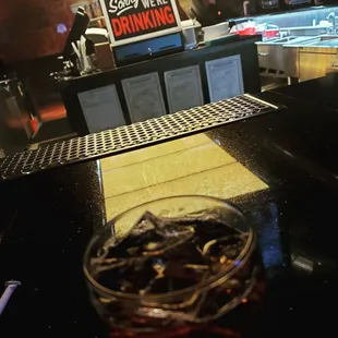 a drink in a glass on a bar