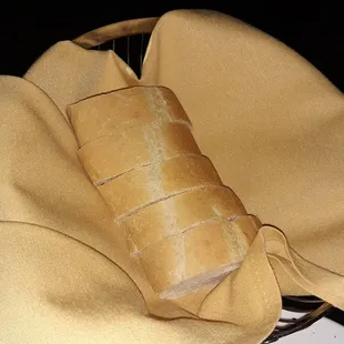 a loaf of bread and a bowl of olive oil