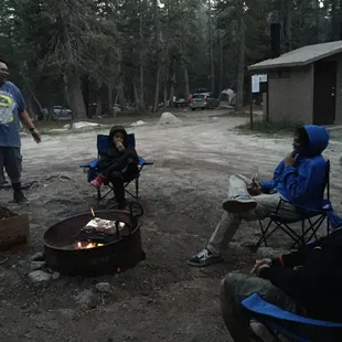 cooking in our firepit. outhouse right next to us, so convenient (no flushing toilet or water tho; no light either so bring head lamp)