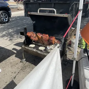 a grill with meat on it