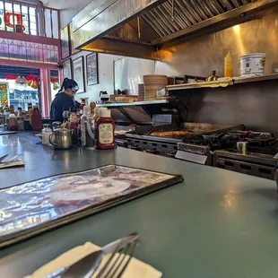 a man in a kitchen preparing food