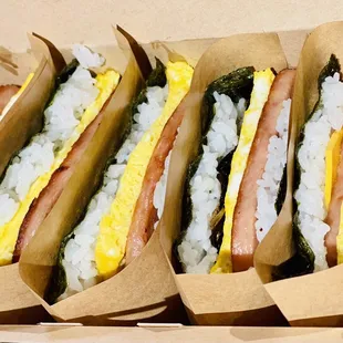 a box of hot dogs with different toppings