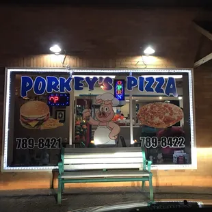 a bench in front of a restaurant