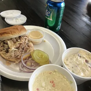 Pulled chicken with white bbq sauce, potato salad, and coleslaw