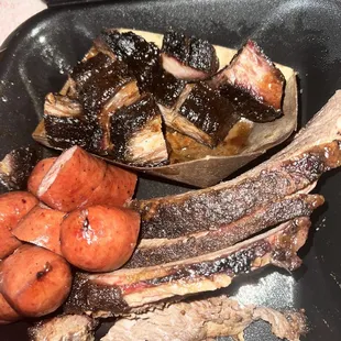 Three meat plate with Brisket, Burnt Ends, and Sausage.