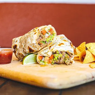 a burrito on a cutting board