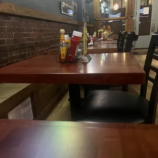 Notice the awful brick wall seating with the hard wooden bench