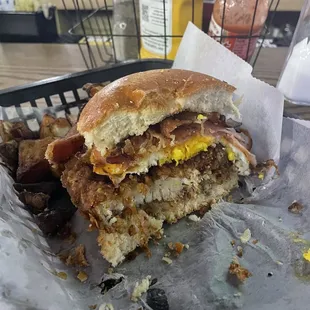Cross section of the &quot;Barnyard&quot;- a sinful and delicious fried chicken, ham, bacon, fried egg and American cheese in a toasted challah roll.