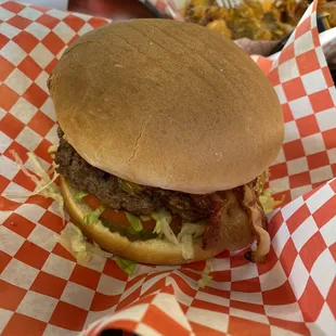 Bacon cheese burger with fried egg inside