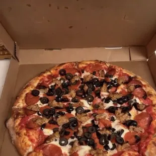 Large pizza with black olives, sausage and pepperoni