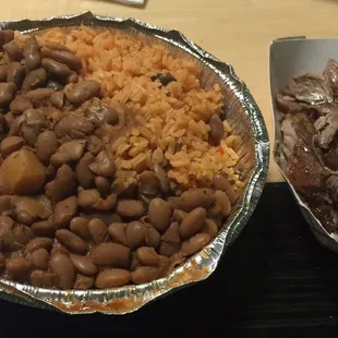 Yellow rice and bean with pernil