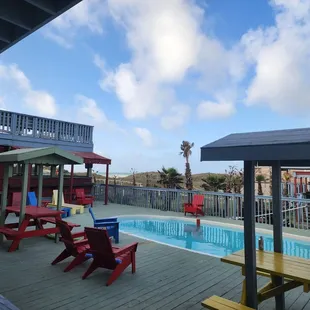 Pool area. Loved the Adirondack chairs.