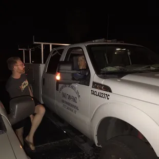 Here is our poor AC tech and his adorable wife, at 10pm the night before Thanksgiving, both trying to get us cool air.