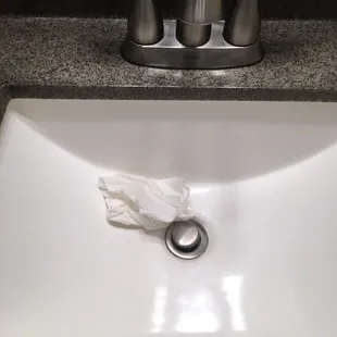 Used toilet paper in sink at check in