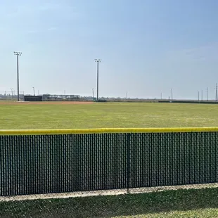 Well-maintained baseball field with lighting