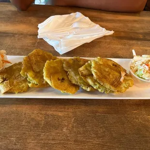 Banann peze avec pikliz! Squeezed and fried plaintain with spicy slaw