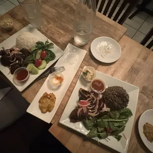 left: fried goat with white rice  right: fried turkey with diri djonjon middle: fried plantains