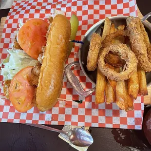Poor boy with onion rings and fries