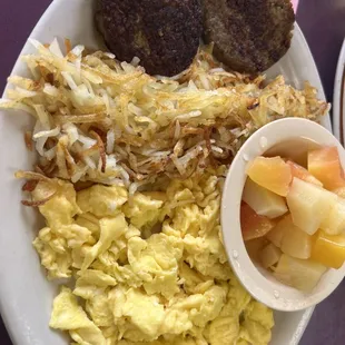 (2) Scrambled eggs, hash browns, sausage, and a fruit cup.