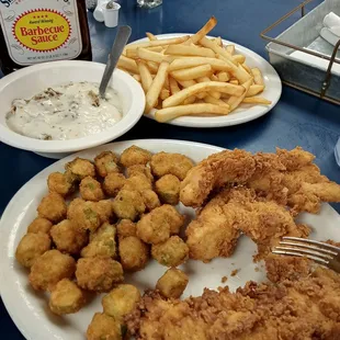 a plate of fried fish and fries