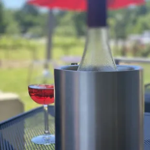 a bottle of wine and a glass of wine