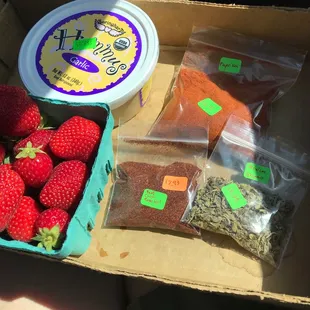 Strawberries, hummus, and a selection of herbs and spices