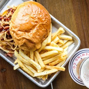 a sandwich and fries on a tray