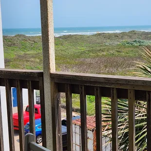 Views of ocean with dumpster.