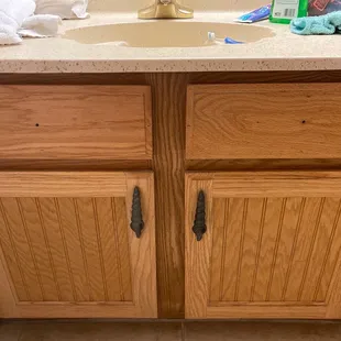 Missing knobs. They are not real drawers but it just looks bad to have holes in them for knobs and then to not have knobs.
