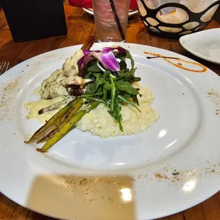 Crabmeat over red snapper over risotto