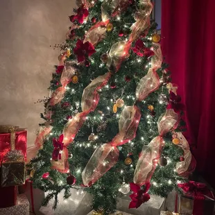 a decorated christmas tree with presents