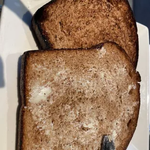 Burnt toast on bottom and new one on top