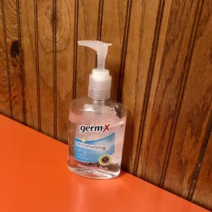 Hand sanitizer on every table