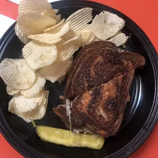 Reuben, pickle, and chips.