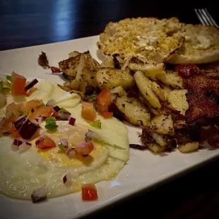 Eggs, potatoes, apple smoked bacon and English muffin topped with fresh pico de gallo