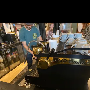 a bari bari serving a cup of coffee