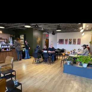 a group of people sitting at tables