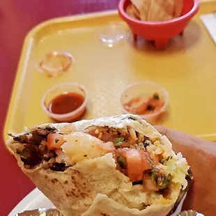 Shrimp burrito   With black beans and sliced roasted green chilis (not spicy), it was delicious!