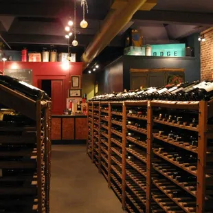 a wine cellar with lots of bottles