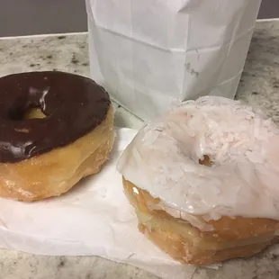 Chocolate covered and coconut sprinkled donuts