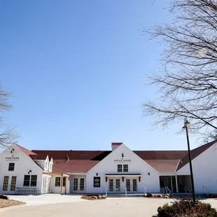 a large white building with a red roof