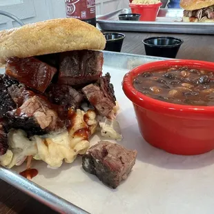Lunch special: brisket sandwich with Mac n cheese and Cole slaw, burnt end beans on the side