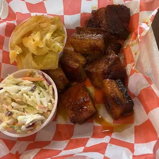 a basket of ribs and coleslaw