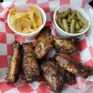 Wings, green beans and smoked cabbage...  FYI, he typically does whole wings but these were all that were available for him at the moment.