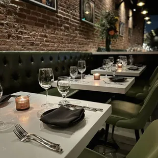 Indoor dining room is very pretty, love the candles and the brick