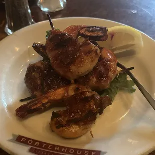 Smokehouse Shrimp Four bacon-wrapped shrimp basted with BBQ sauce. Over a million served since we first opened!