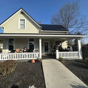Exterior.  Porch has two tables and a bench