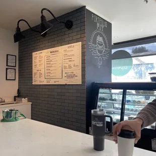 a person holding a cup of coffee
