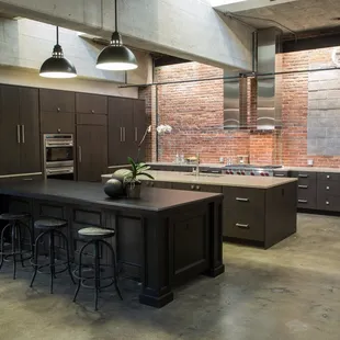 a large kitchen with a center island