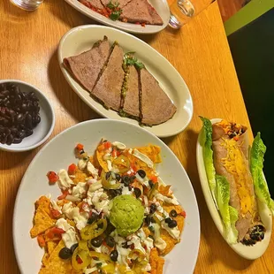 Nachos supreme, Spana-Rice Quesadilla, Sawsage Pizzadilla Quesadilla Specialty, and the Burrito!